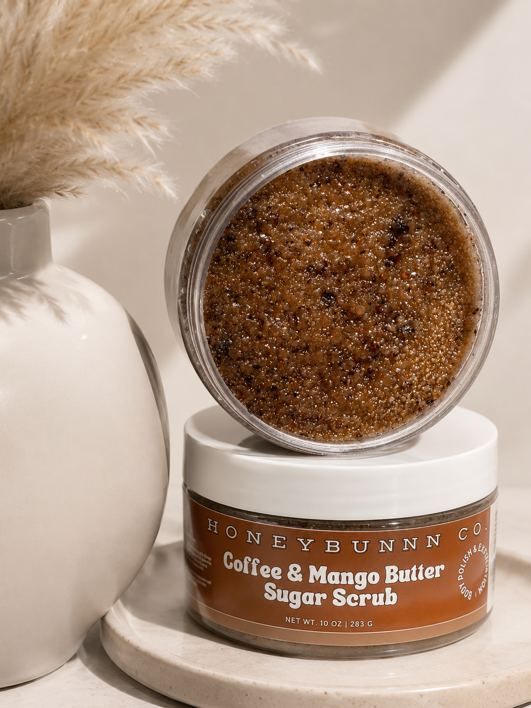 Jar of Honeybunn Coffee & Mango Butter Sugar Scrub on a neutral background